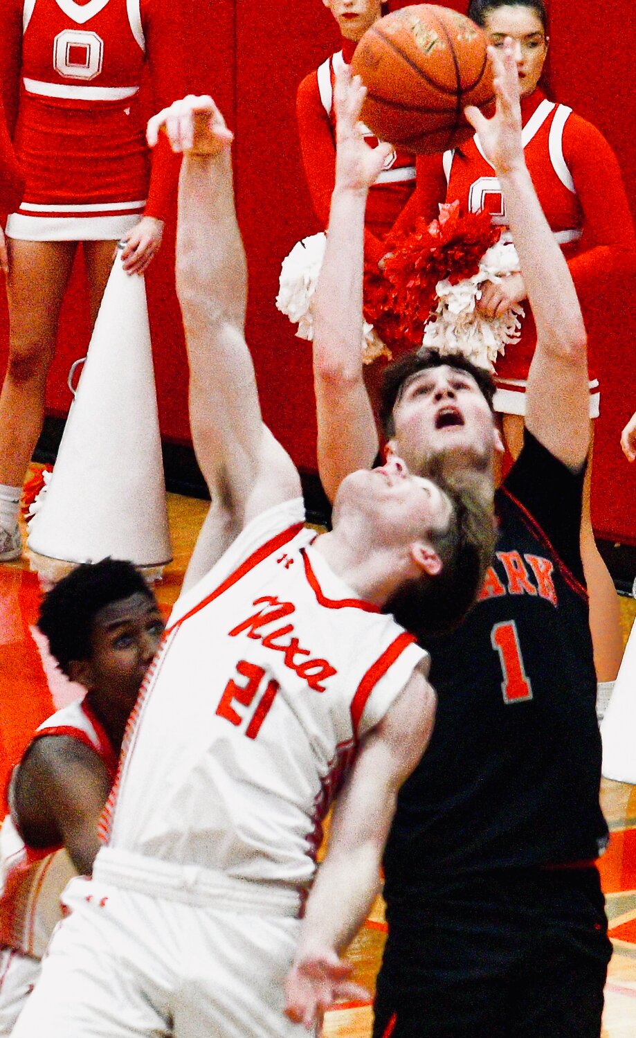 OZARK'S JACE WHATLEY reaches for a pass ion between Nixa's Adam McKnight and Josh Peters.