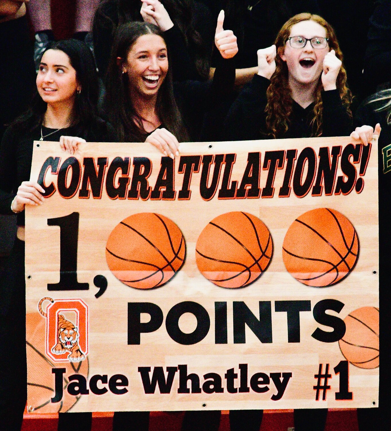 OZARK FANS celebrate Jace Whatley joining the Tigers' 1,000-point club.