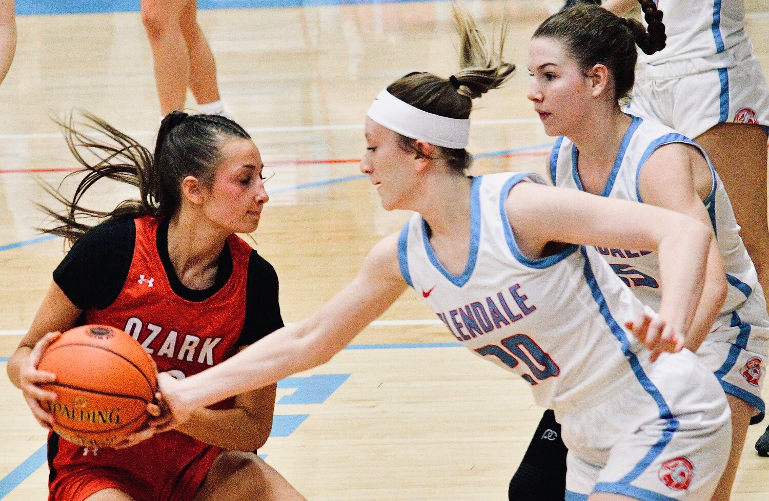 OZARK'S MACEY SULT holds onto the ball under pressure.