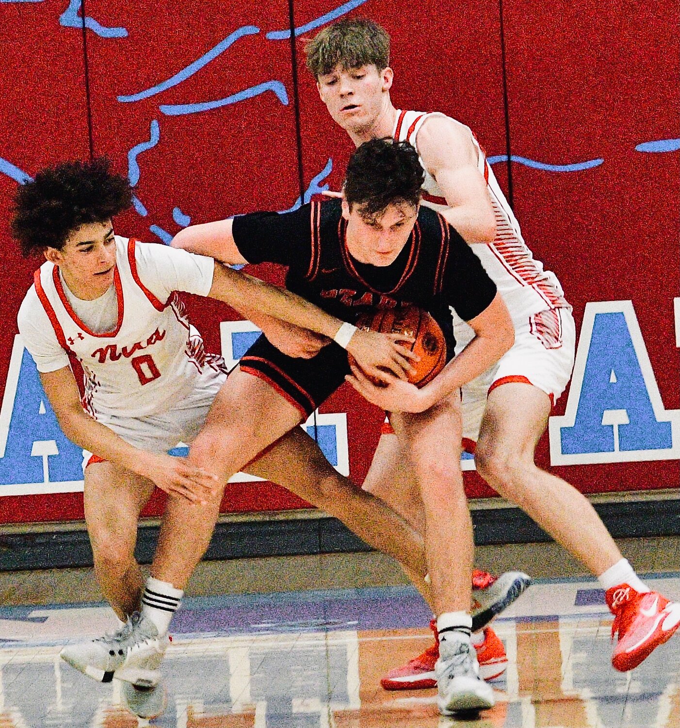 OZARK'S JACE WHATLEY holds onto the ball as Devon Kemp tries to wrestle it away from him.