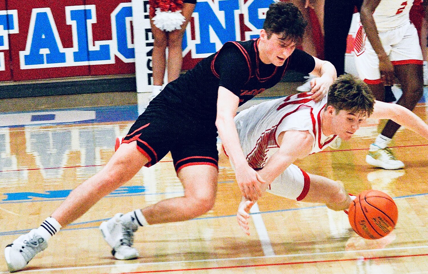 OZARK'S JACE WHALTEY AND NIXA'S ADAM MCKNIGHT chase after a loose ball.