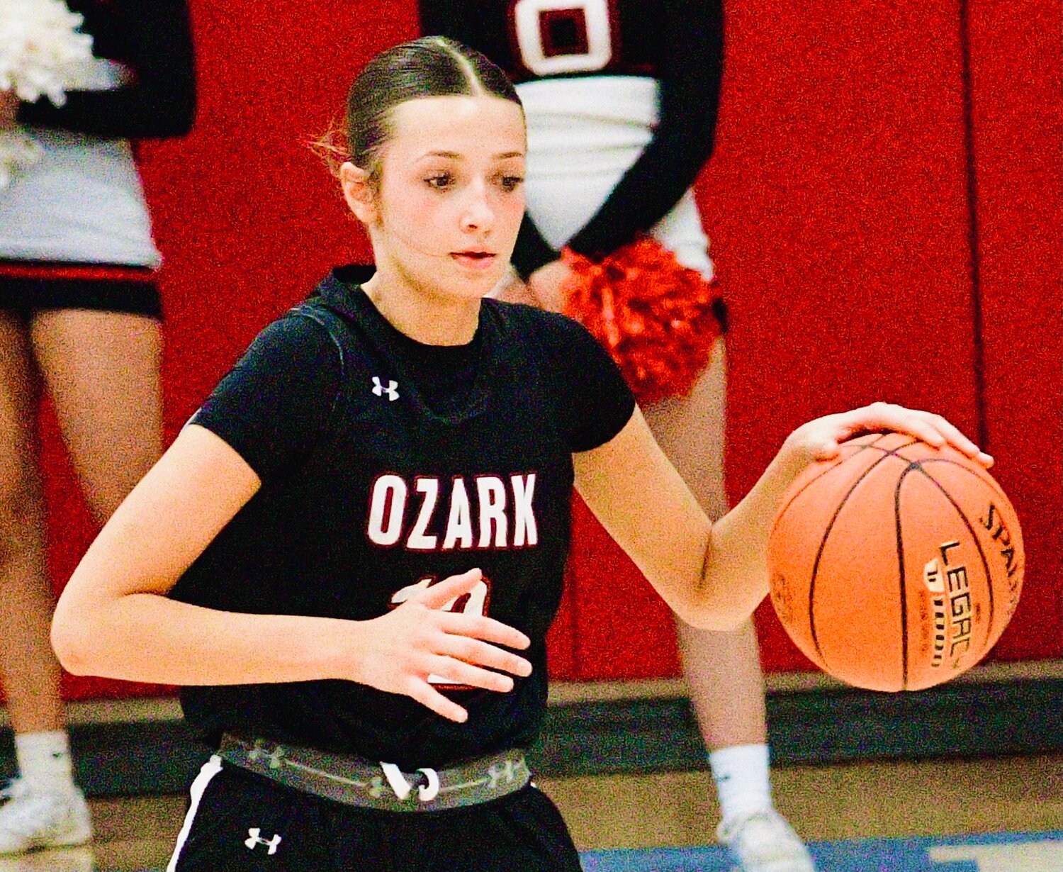 OZARK'S MACEY SULT handles the ball.