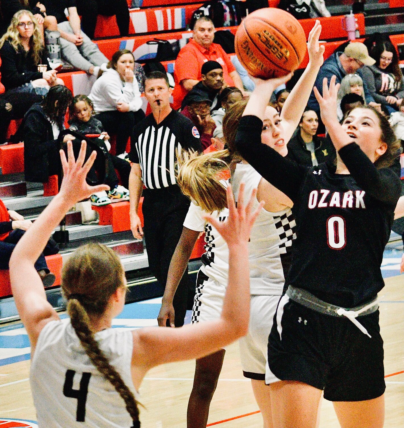OZARK'S KORI ROUSSELL shoots in front of a defender.