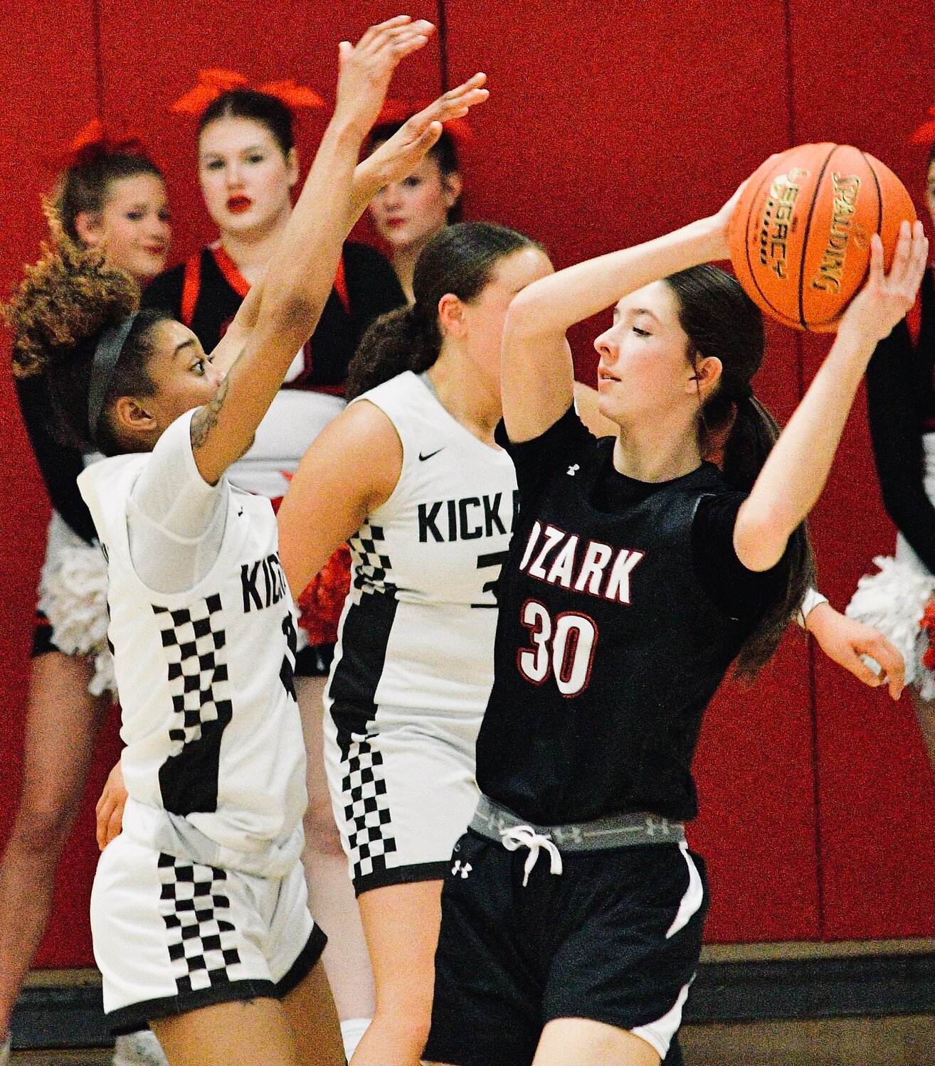 OZARK'S AVERY HAVENS searches for an open teammate.