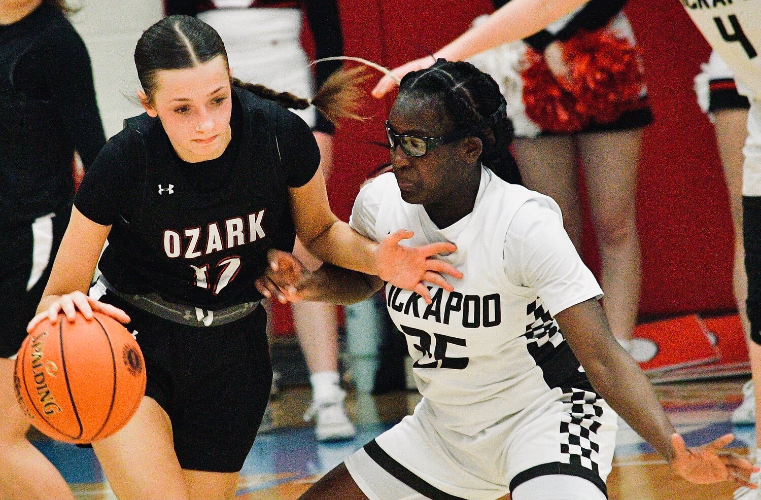 OZARK'S MACEY SULT looks for room around a defender.