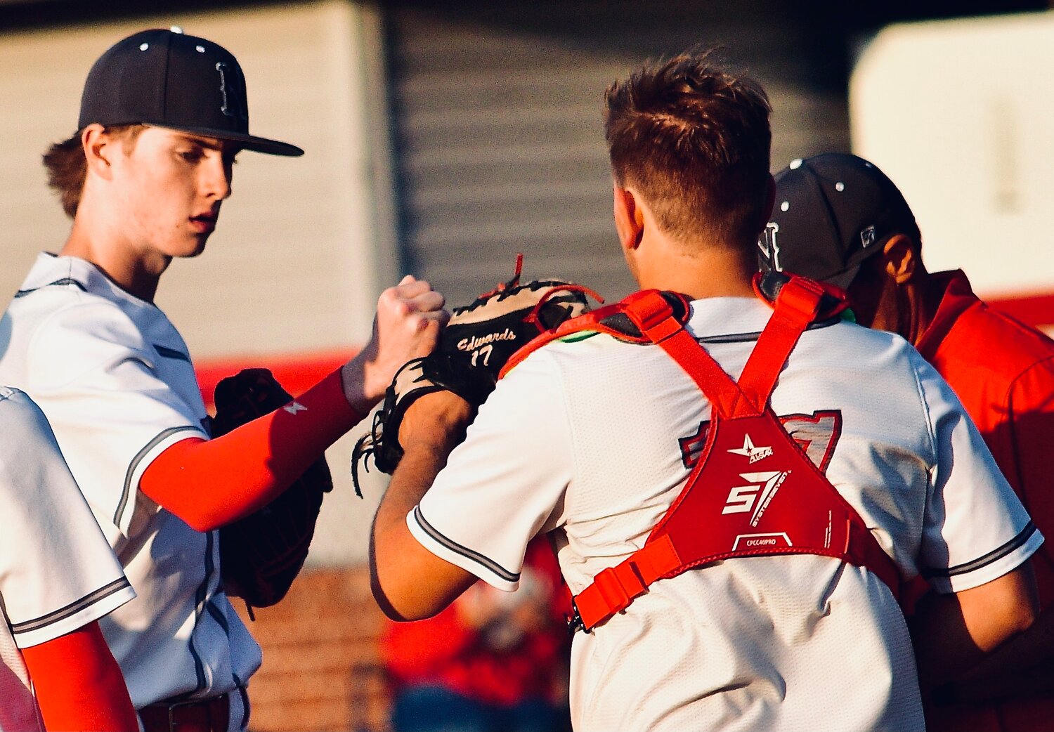 NIXA'S DREW CREED AND JACK EDWARDS exchange a fist bump.