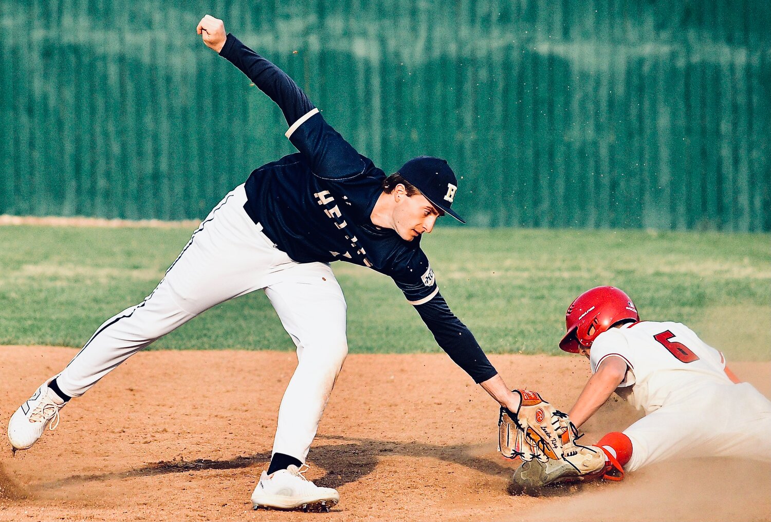 OZARK'S CADEN MCGEHEE avoids a tag at second base.