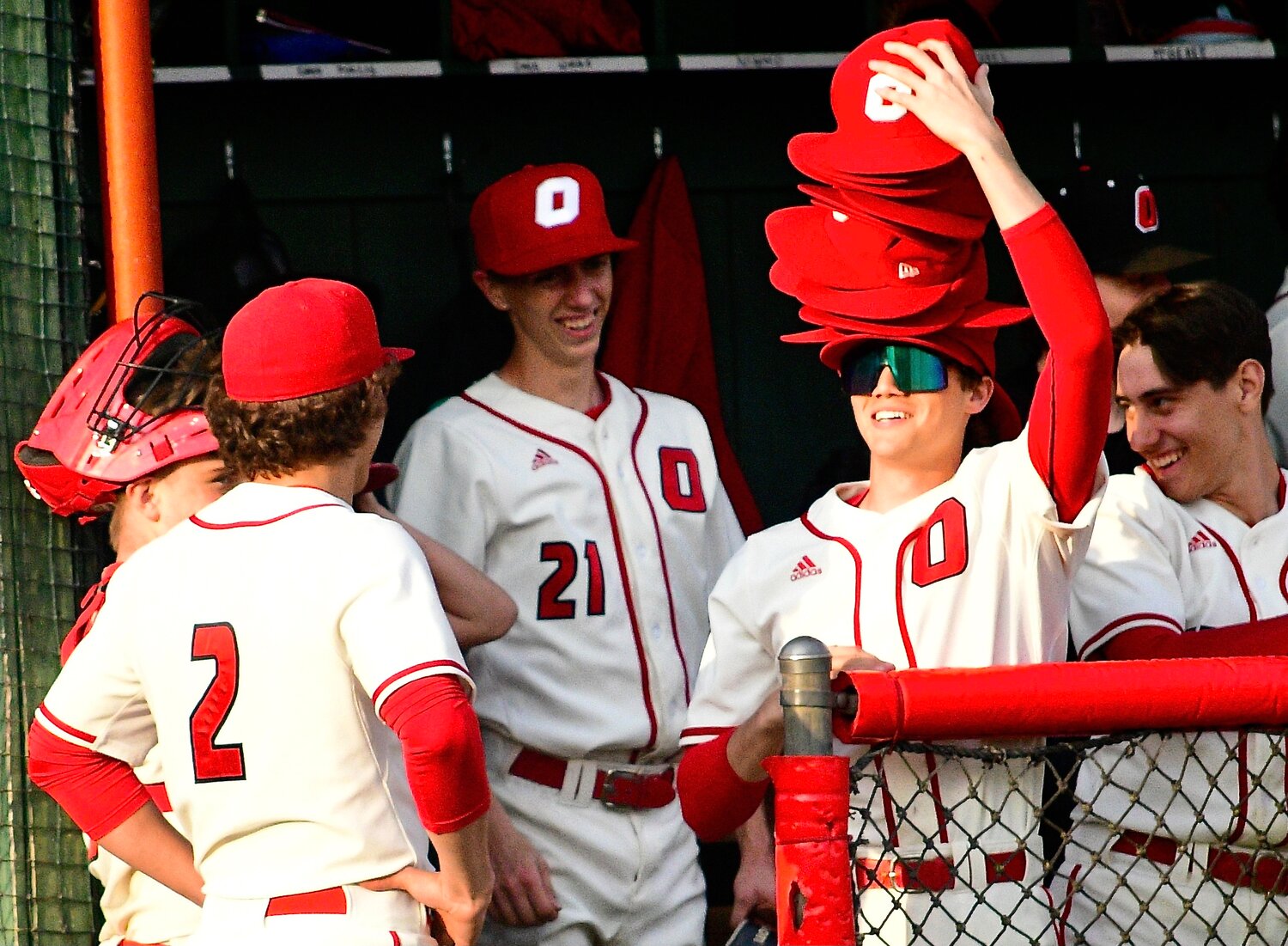 OZARK'S AIDAN DAVIS proudly shows of his stack of hats.