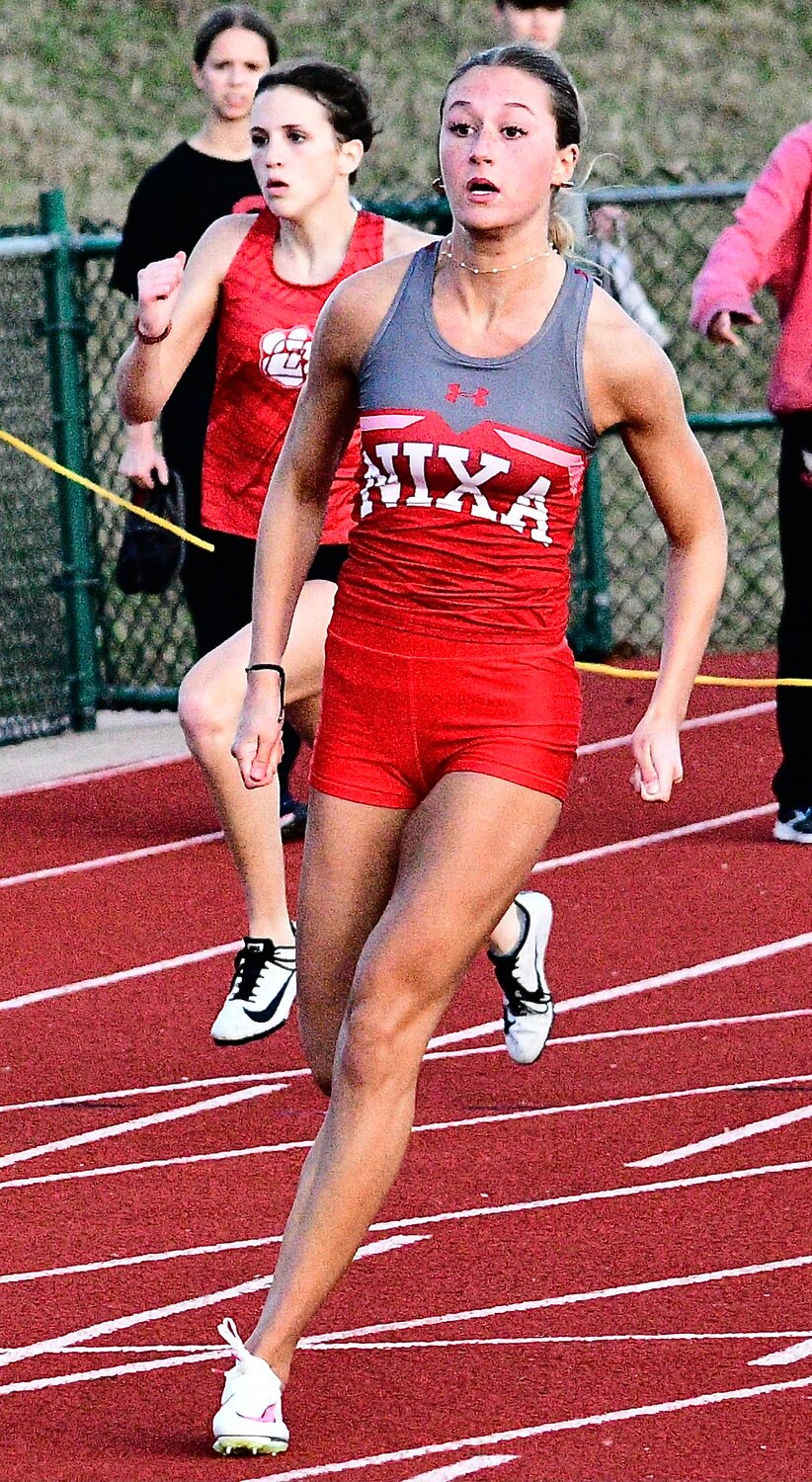 NIXA'S TAYLOR HOPPER breaks away from the pack in the 200 at the Branson Relays .