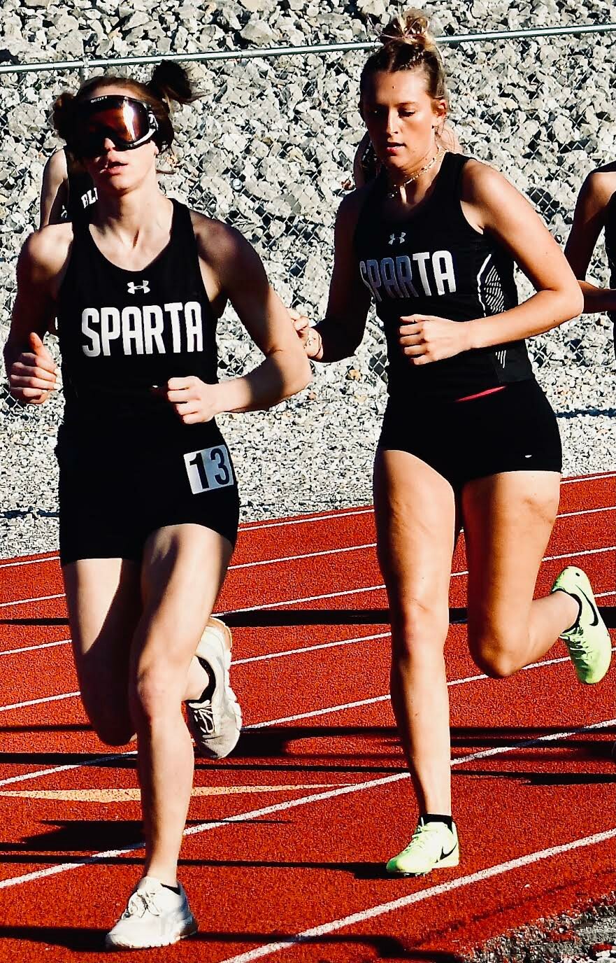 SPARTA'S RYLIE MCMURRY AND ALIVIA LOVELAND run side by side.