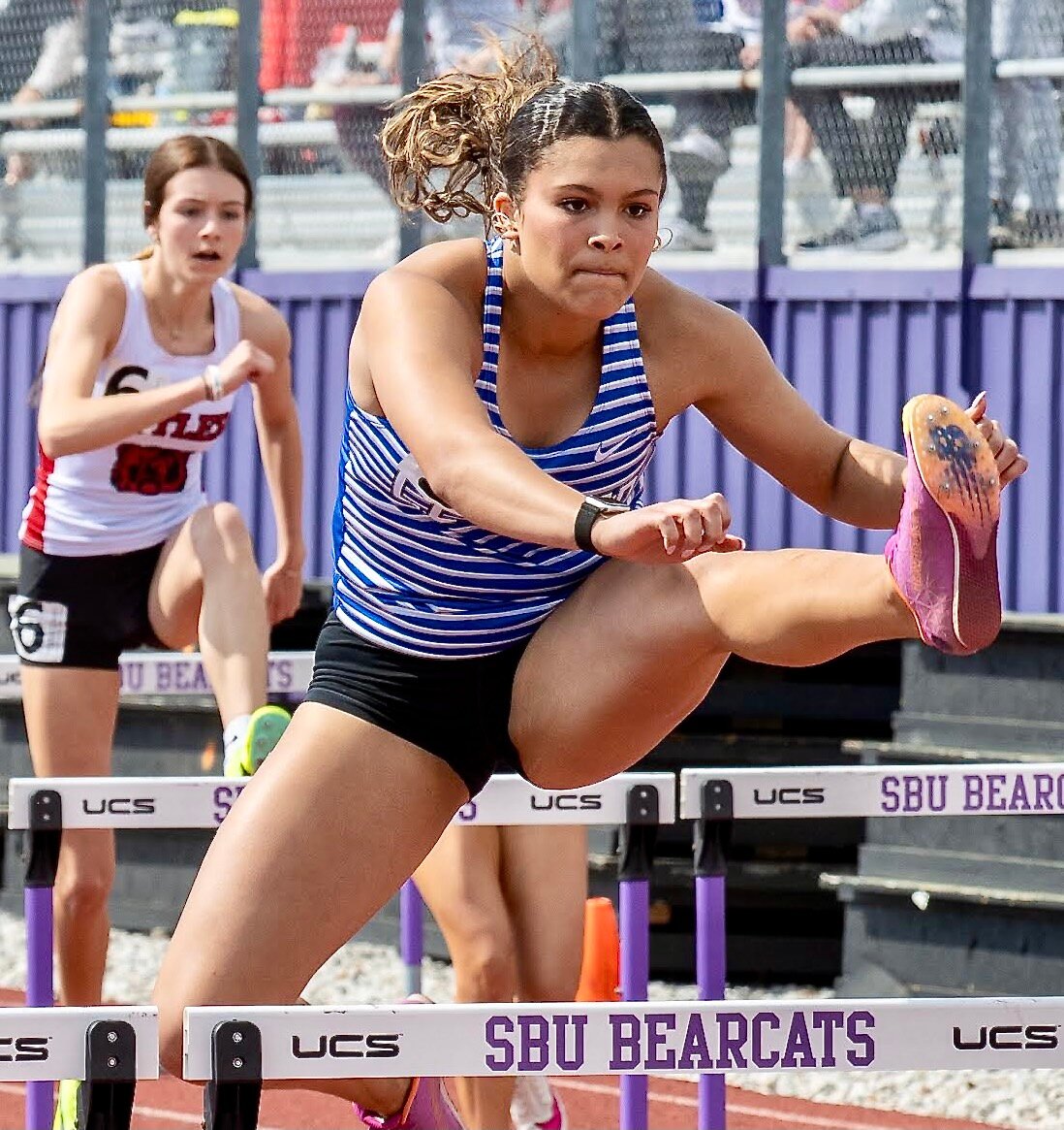 CLEVER'S MALIYA CLARK clears a hurdle.