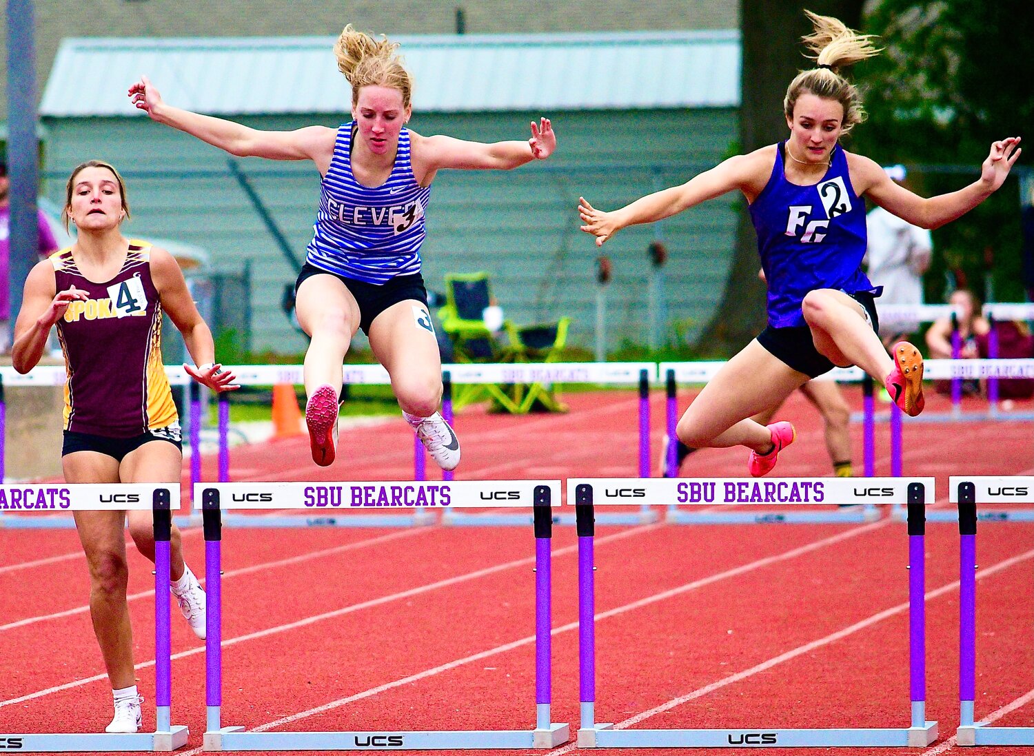 CLEVER'S VALERIE COWLES, middle, nears the finish of the 300 hurdles.