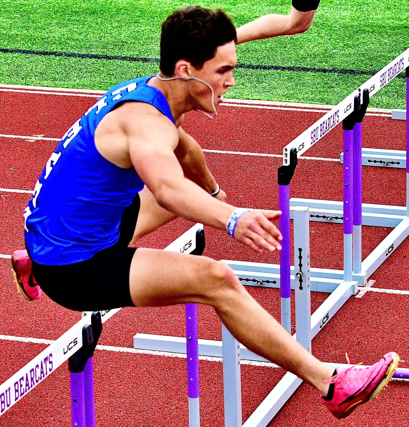 CLEVER'S GAGE EVANS races toward the finish of the 300 hurdles.