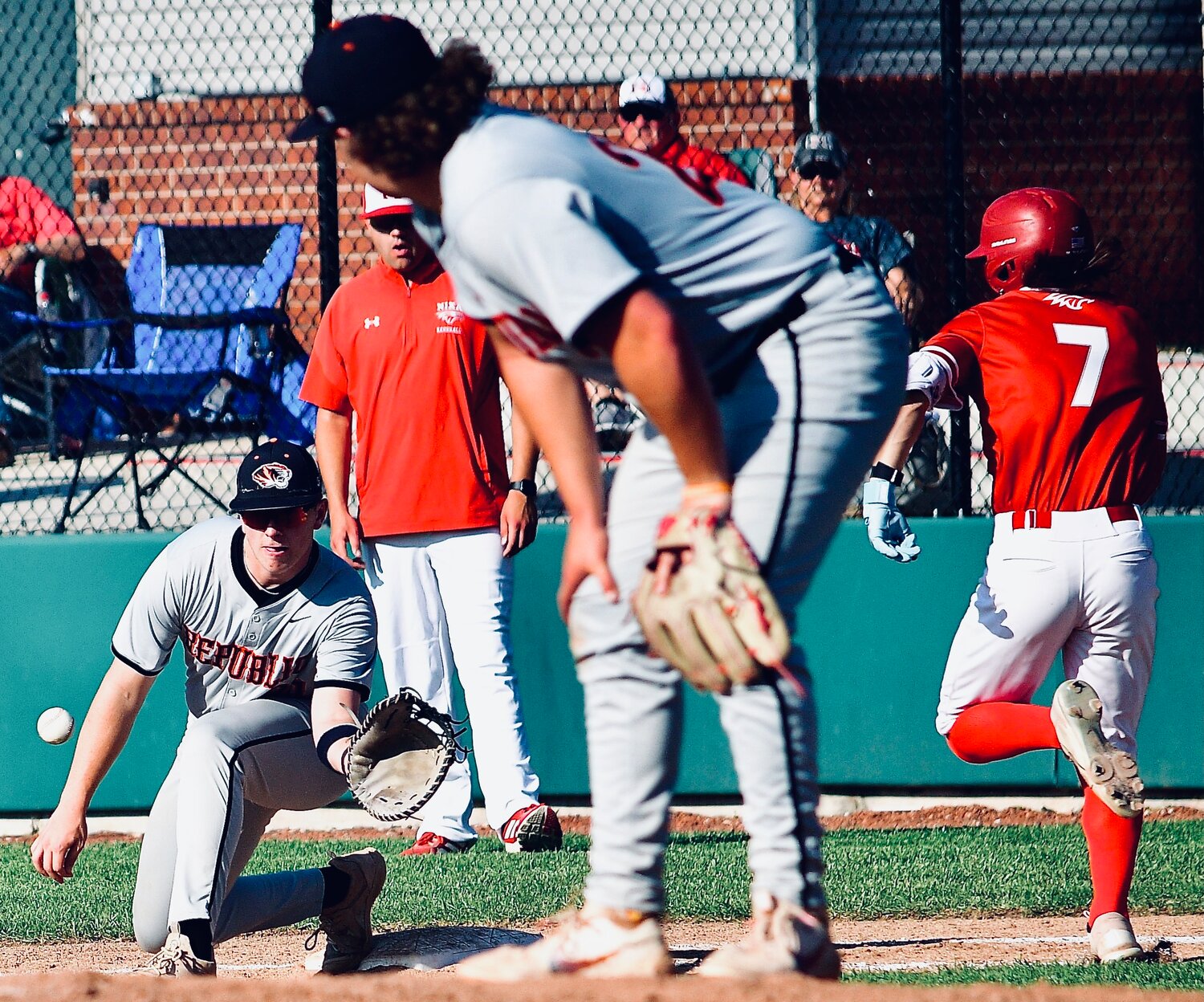 NIXA'S WYATT VINCENT tries to beat a throw at first base.