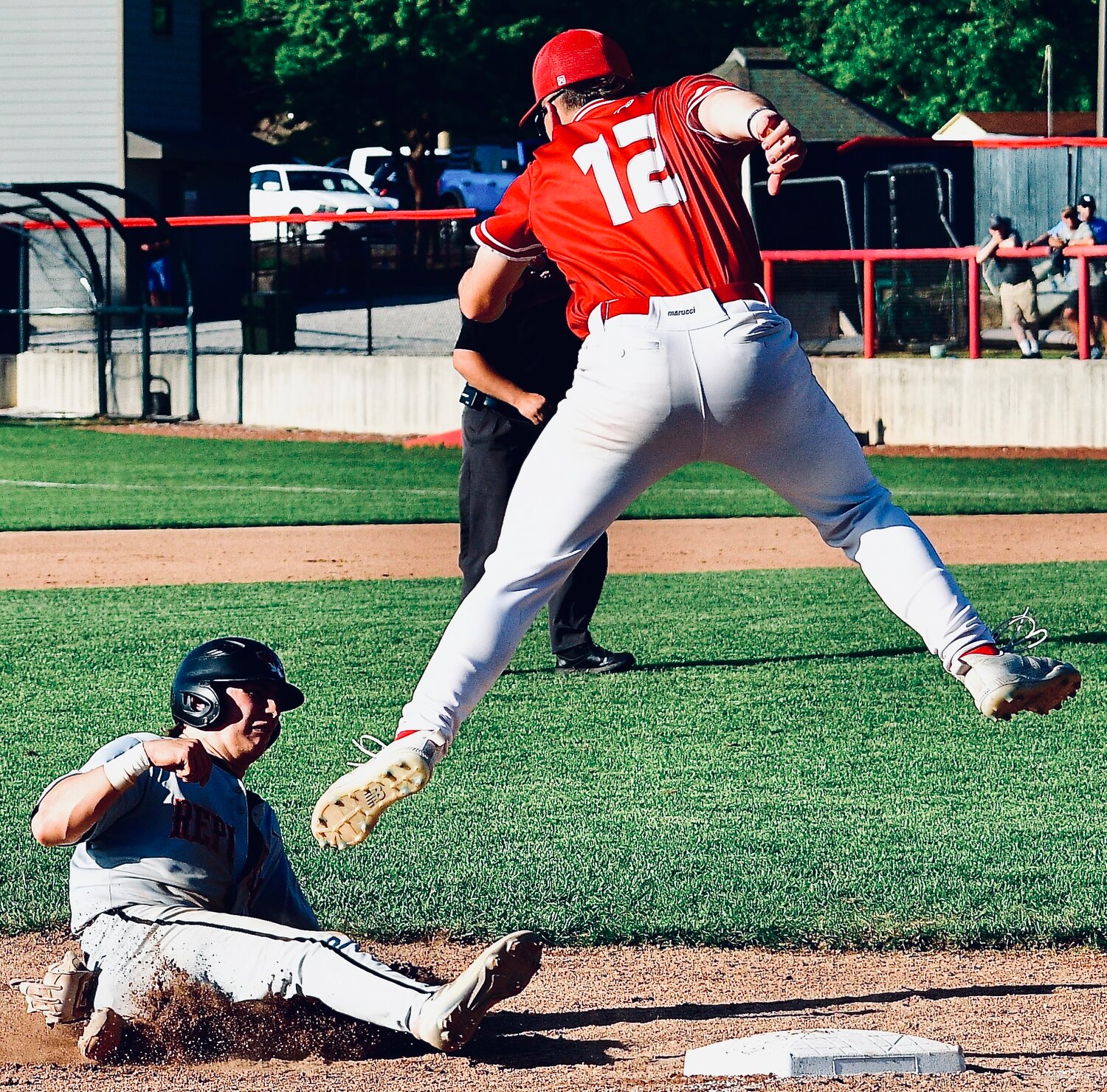 NIXA'S BRODEN MABE gets set to apply a tag on a Republic baserunner at third base.