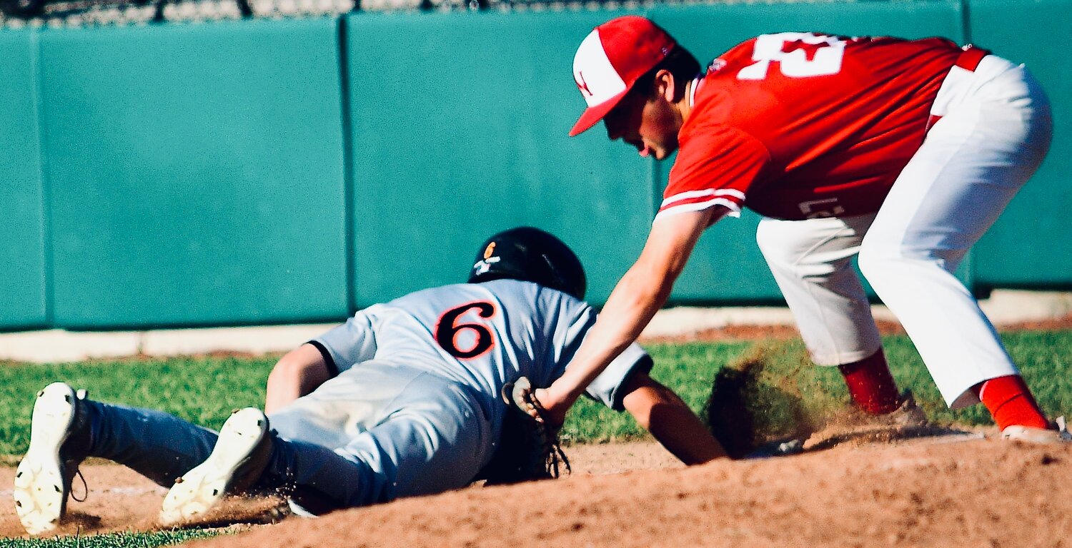 NIXA'S NATE UBER applies tag on a Republic baserunner.