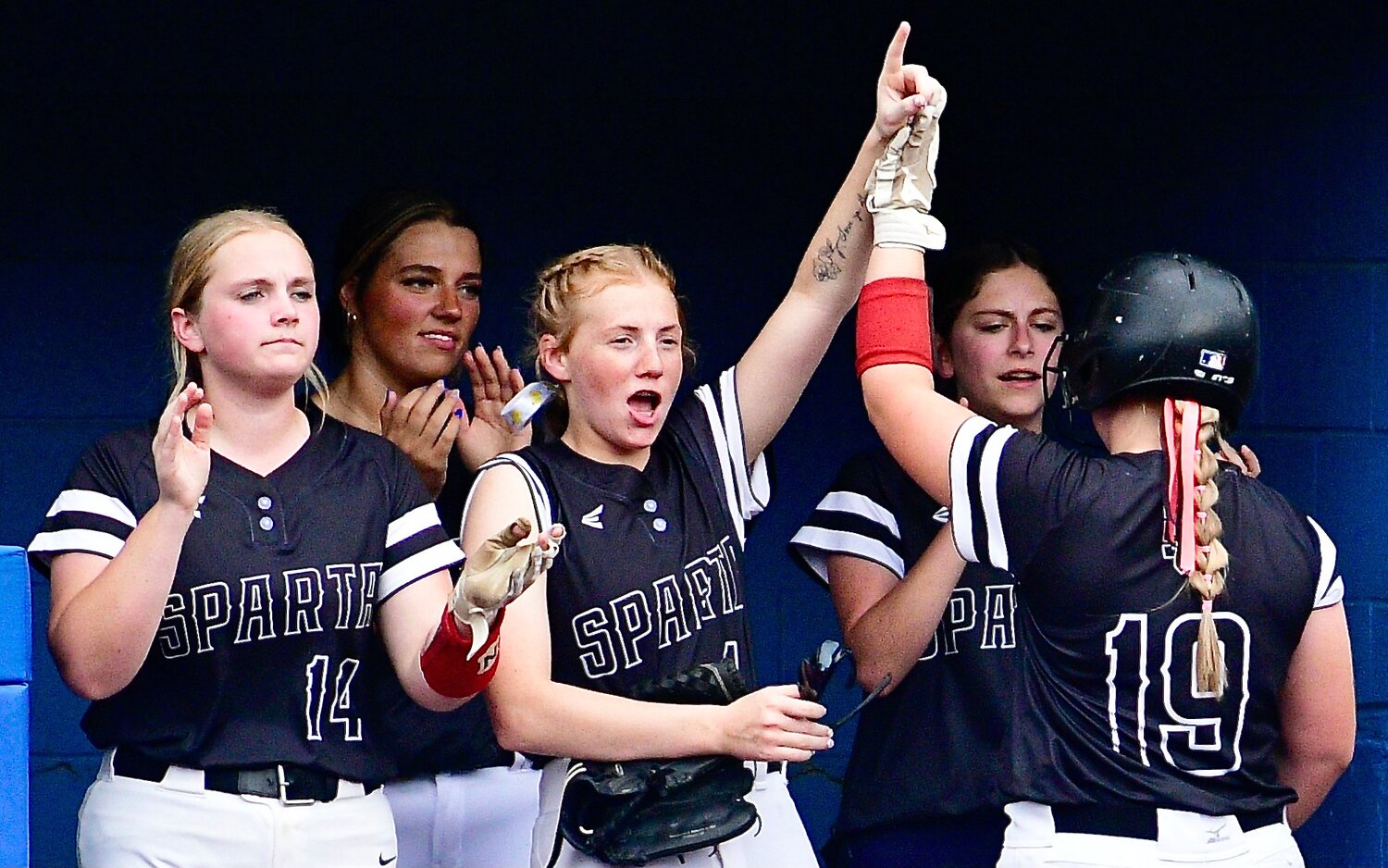 SPARTA'S MYA FULTON AND ADDISON TAYLOR exchange a high-five.