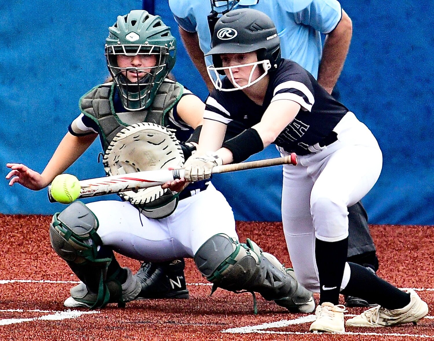 SPARTA'S MYA FULTON posts one of her two bunt singles.