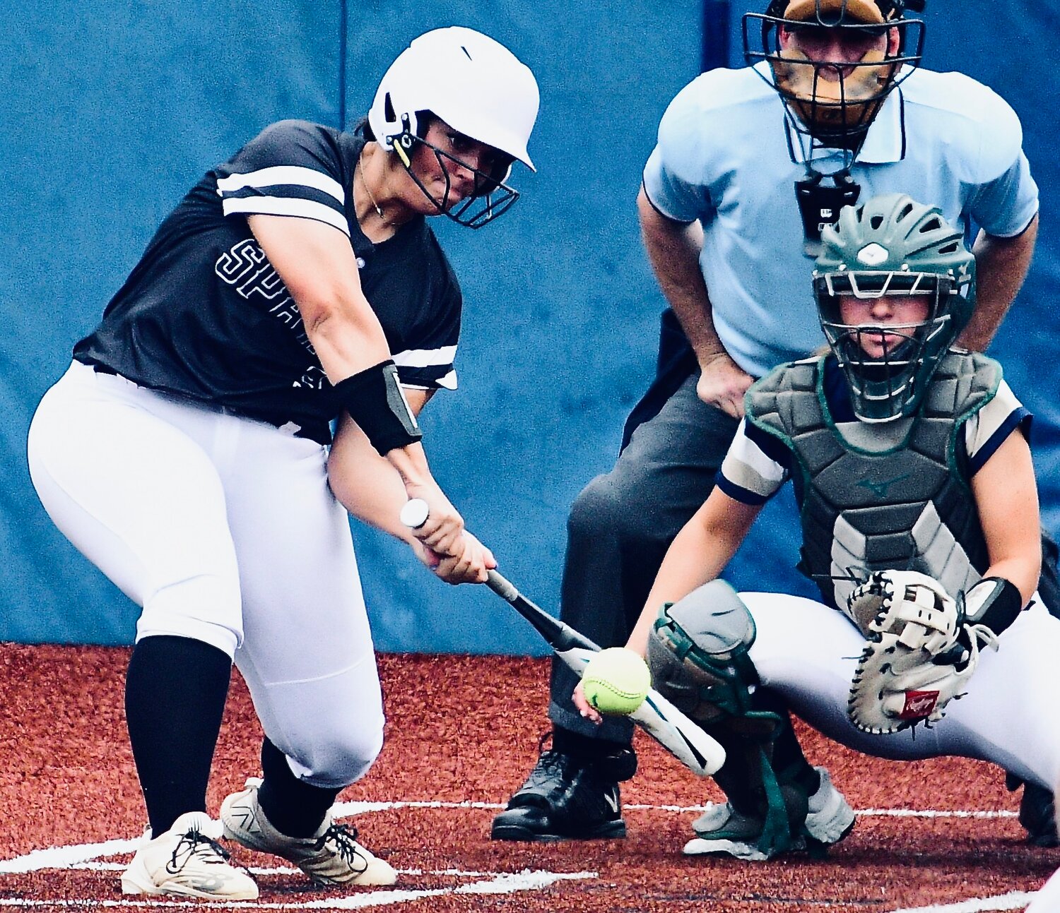 SPARTA'S KENZIE WILSON reaches for an inside delivery.