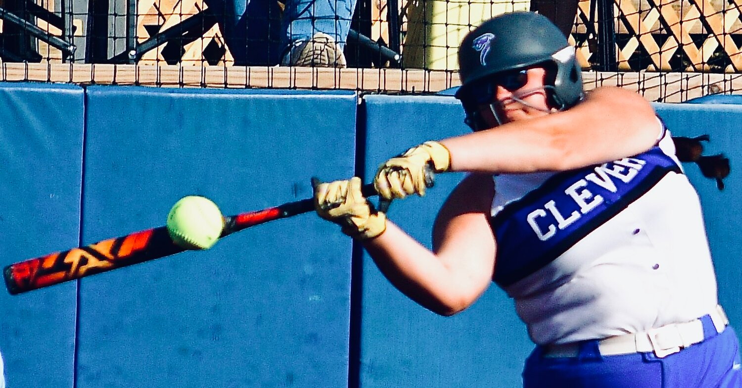 CLEVER'S PIPER STEELE takes a swing at a letter-high fast ball.