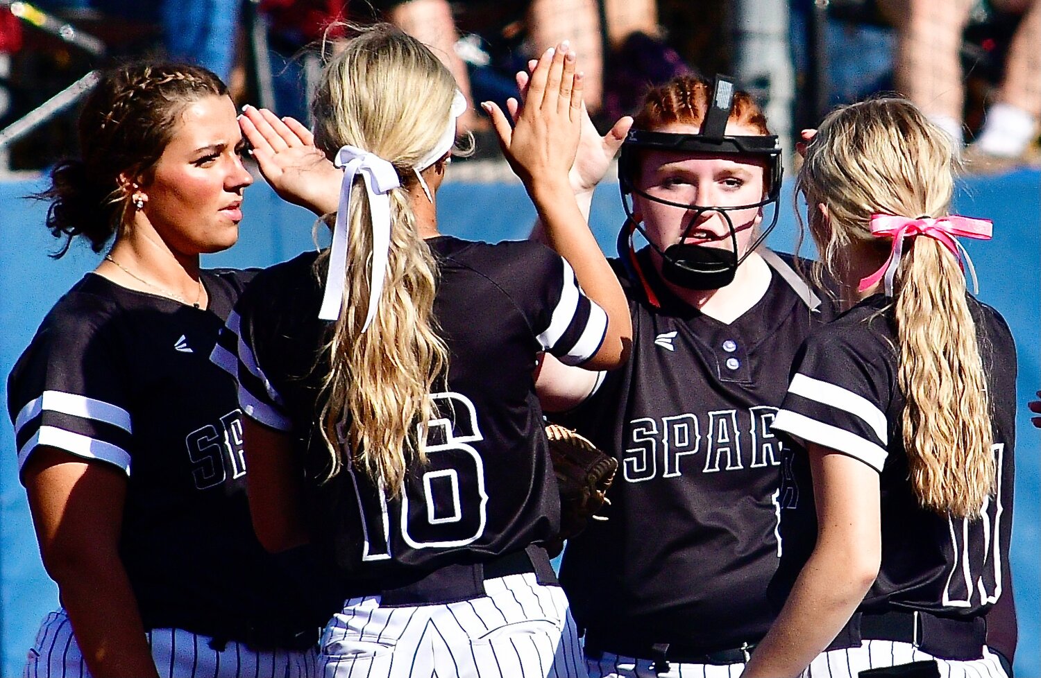 SPARTA'S ADDIE HUMBLE receives high-fives from infiedlers.