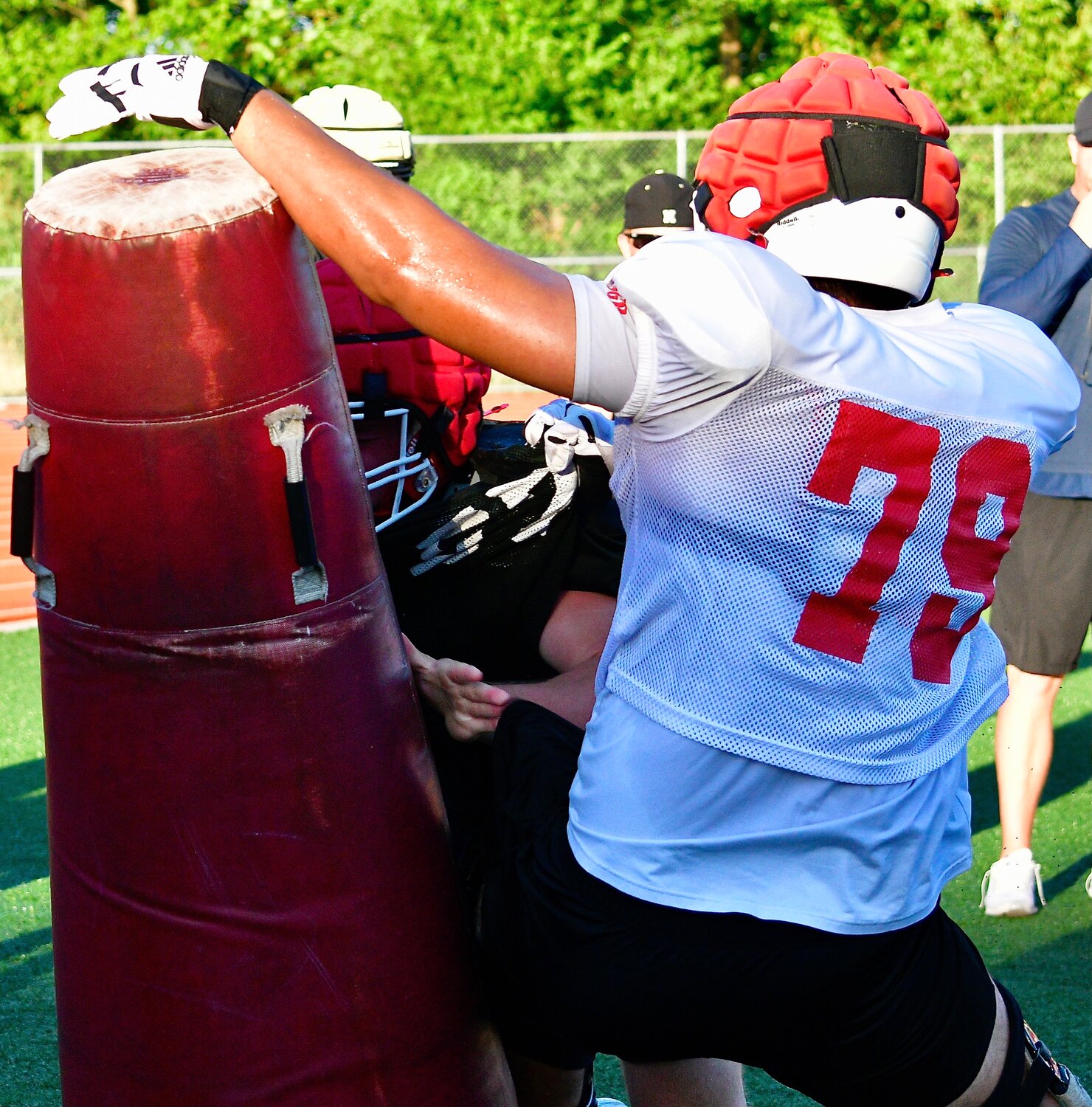 OZARK'S RUBEN ARVIZU reaches a tackling dummy against Nixa's Jackson Cantwell.