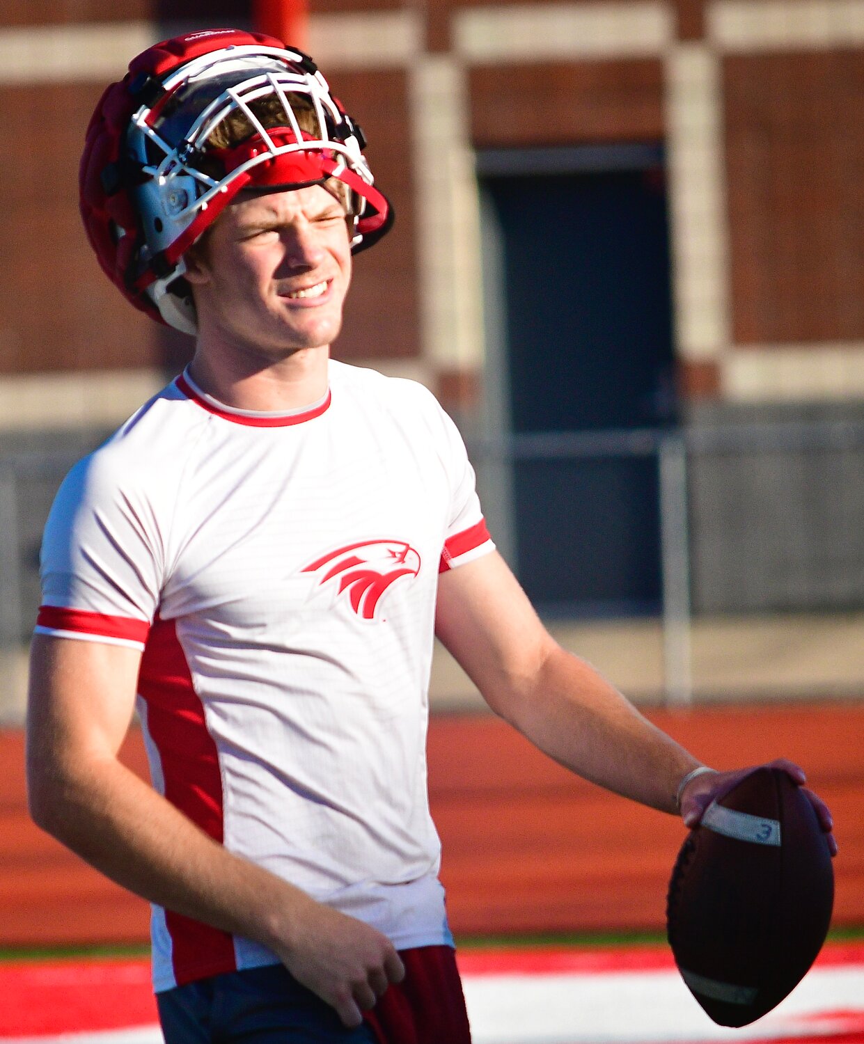 NIXA'S ADAM MCKNIGHT is all smiles after throwing a touchdown pass.