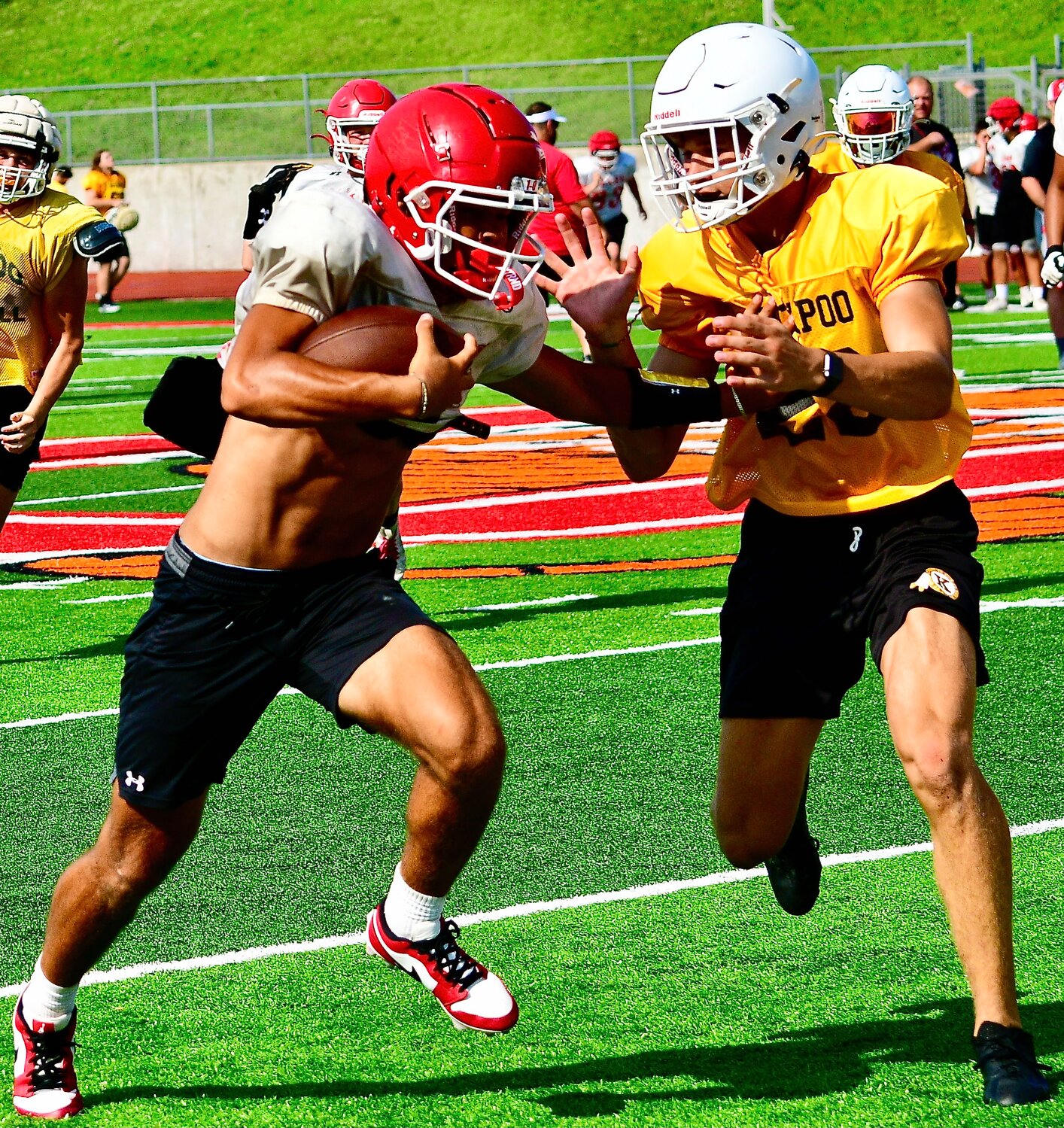 OZARK'S SAM CLARK tries to find room around a Kickapoo defender.
