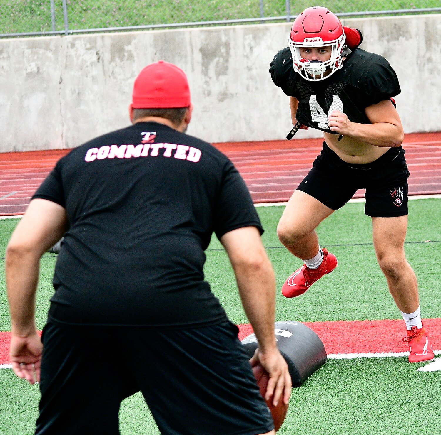 OZARK'S PARKER ELLIOTT runs through a drill.