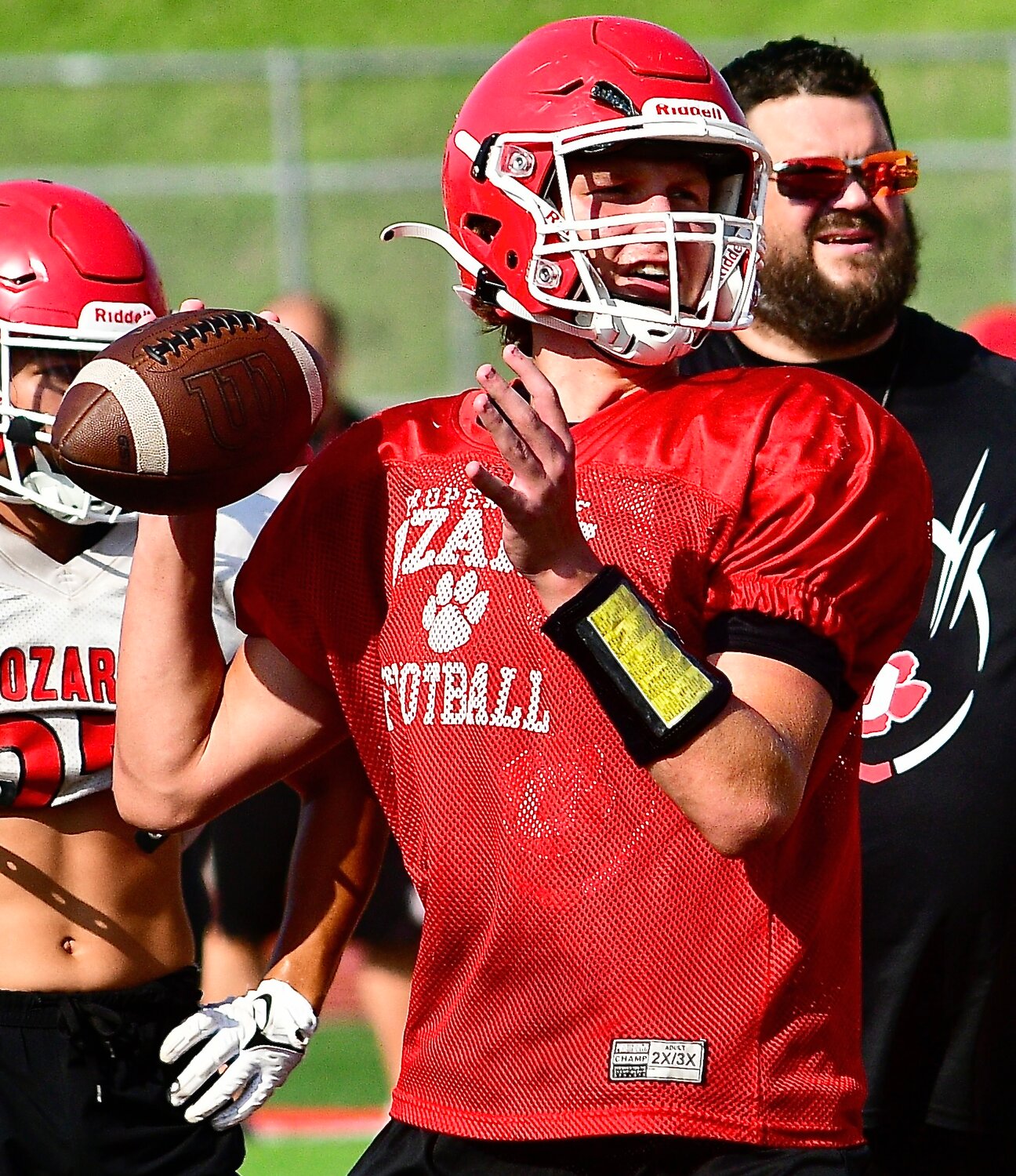 OZARK'S PEYTON RUSSELL looks downfield for a receiver.