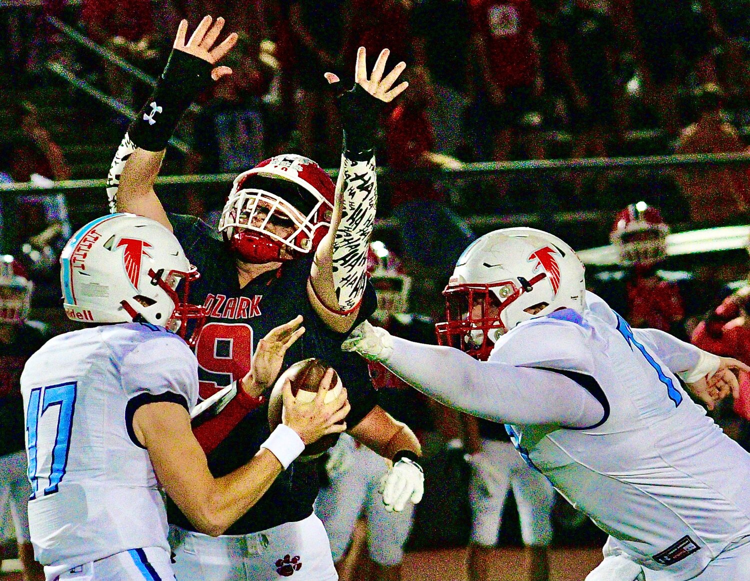 OZARK'S RUBEN ARVIZU beats a Glendale defender on his way to a quarterback sack.