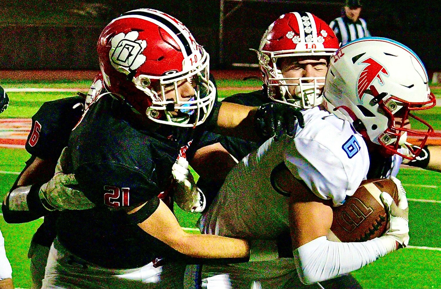 OZARK'S BRYCIEN HOERNER pushes a Glendale ball-carrier out of bounds.