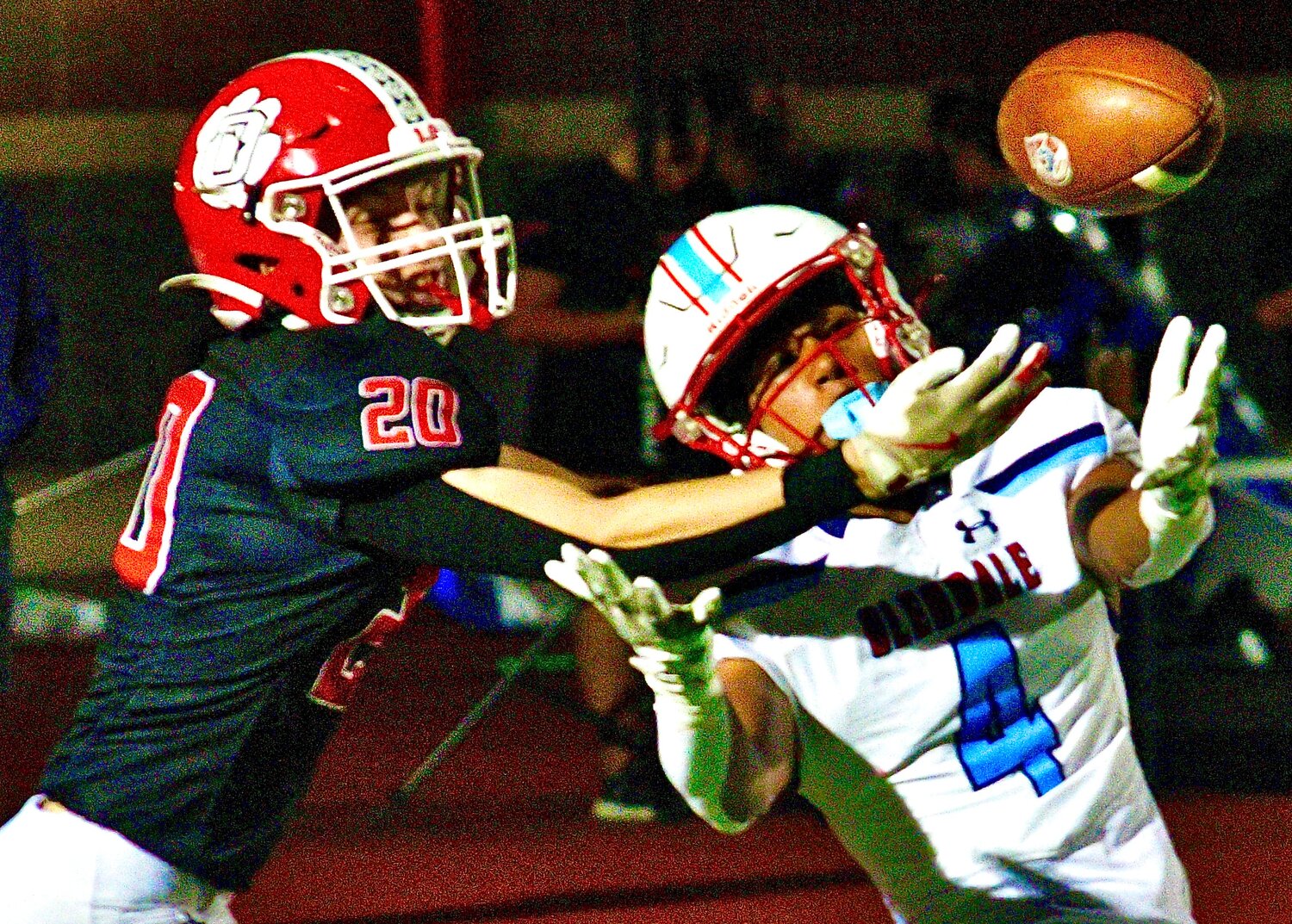 OZARK'S STERLING STINE reaches for a Glendale pass.