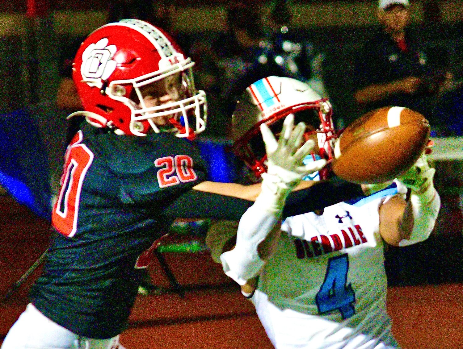 OZARK'S STERLING STINE tips the ball away from a Glendale receiver.