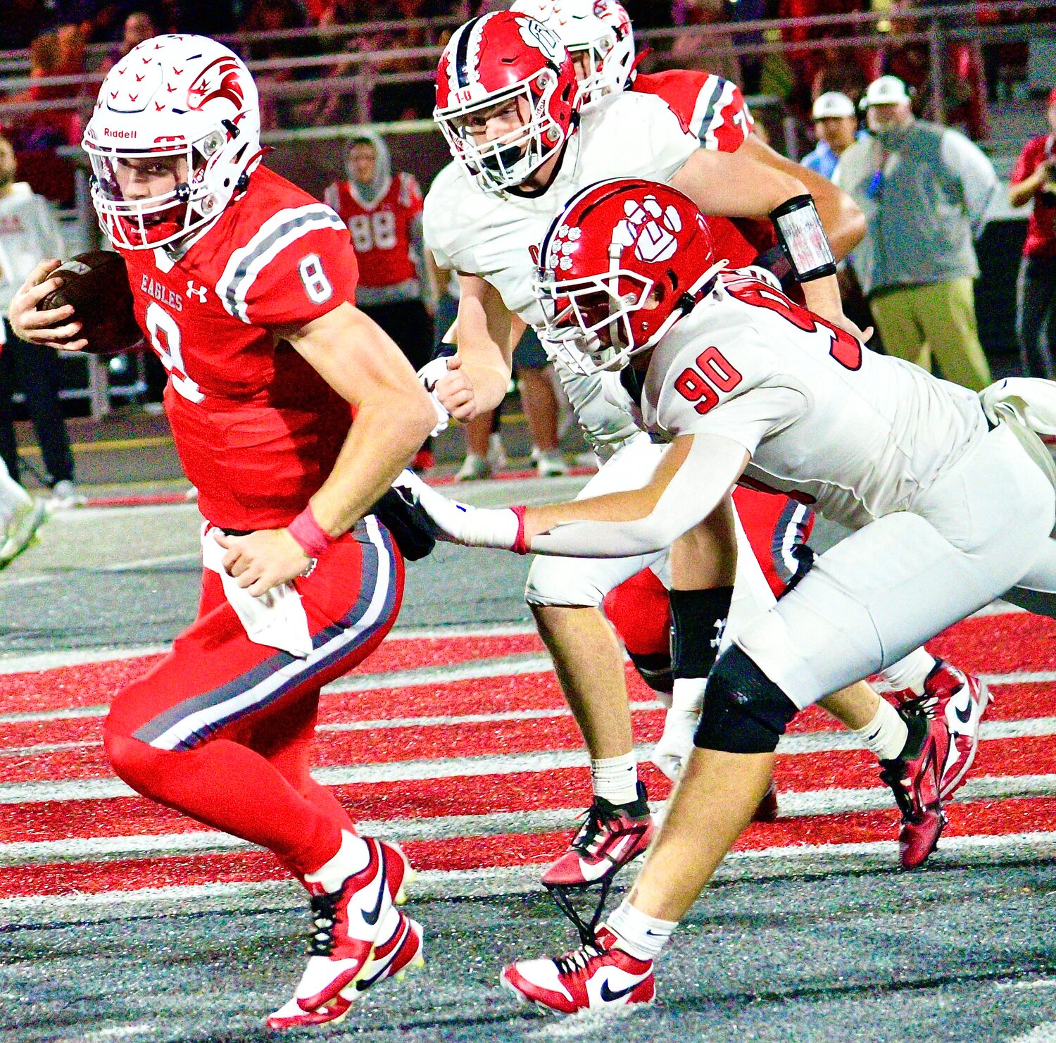 NIXA'S ADAM MCKNIGHT tries to elude Ozark's Hendrix Hembree.