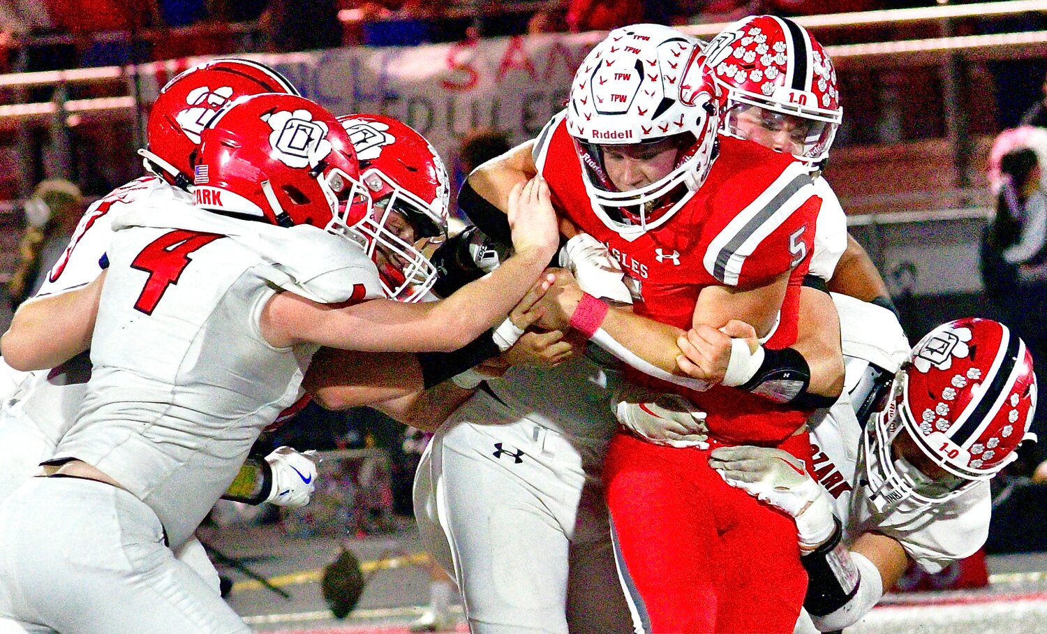 NIXA'S DYLAN REBURA meets up with a host of Ozark defenders.