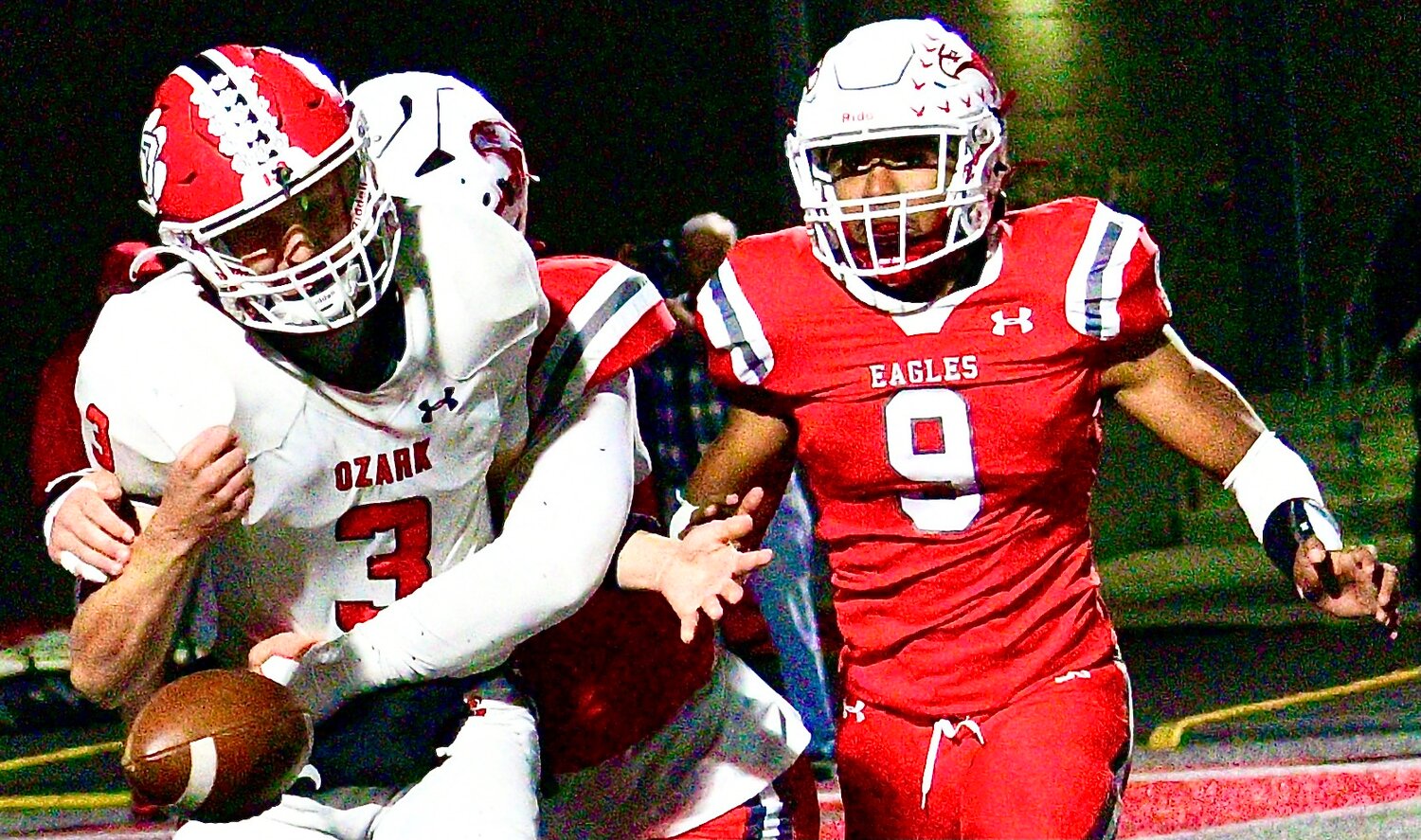 NIXA'S WESTON WELDON forces a fumble by Ozark's Peyton Russell.