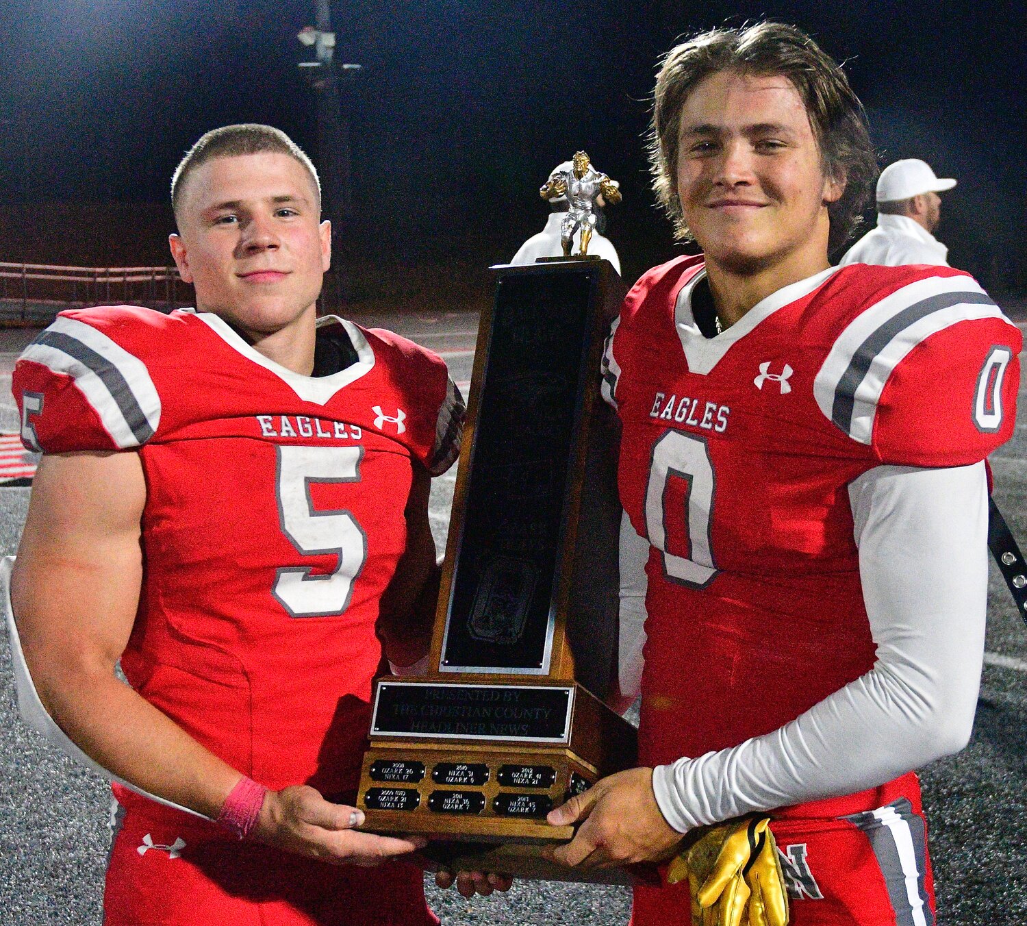 NIXA'S DYLAN REBURA AND WYATT VINCENT pose with the Backyard Brawl trophy.