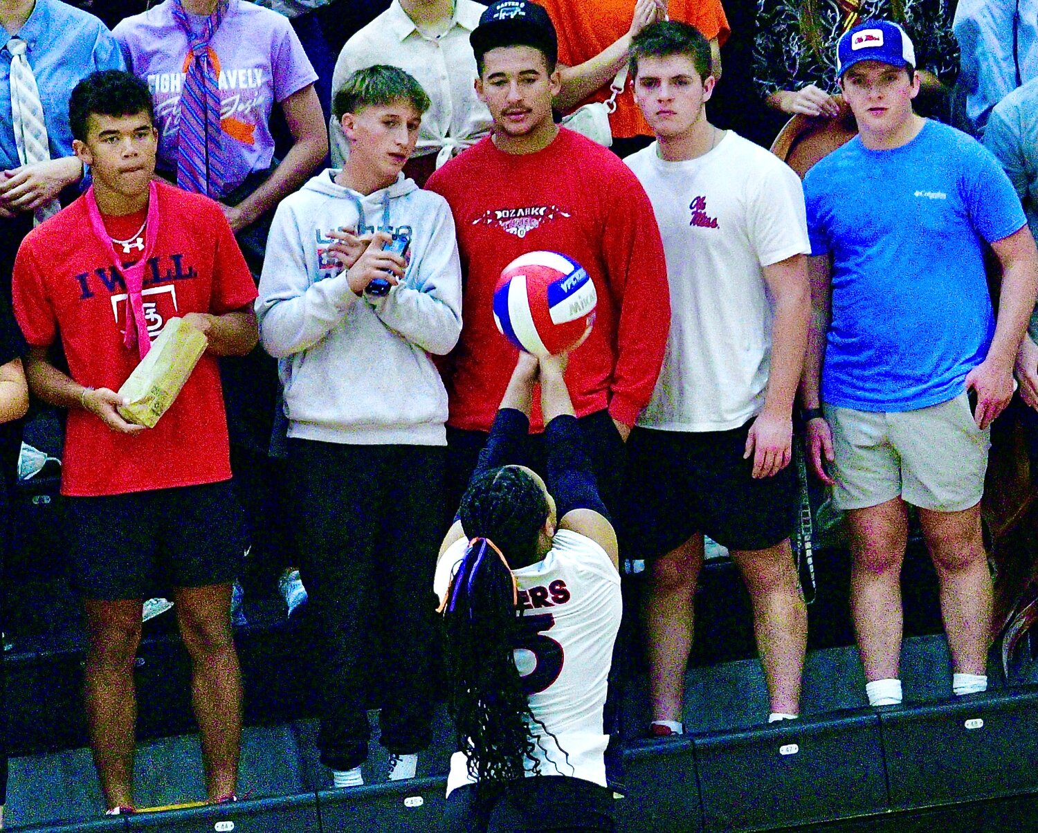 OZARK'S REECE COOK chases down a ball in front of the Ozark student section.
