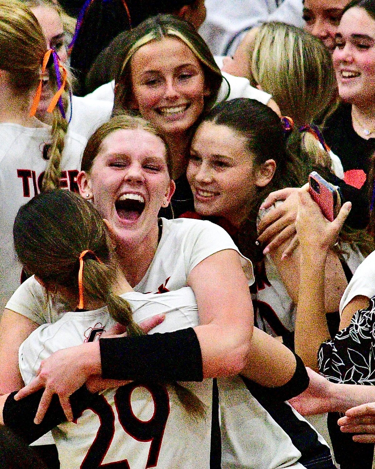 OZARK'S TARA VENABLE is surrounded by teammates during the Lady Tigers' Final Four celebration.