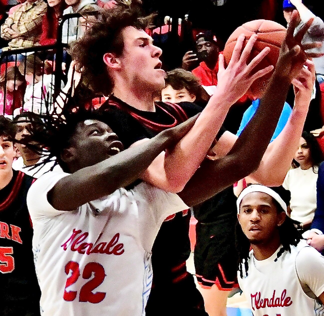 OZARK'S KYLAN PICKREN wins a battle for a board.