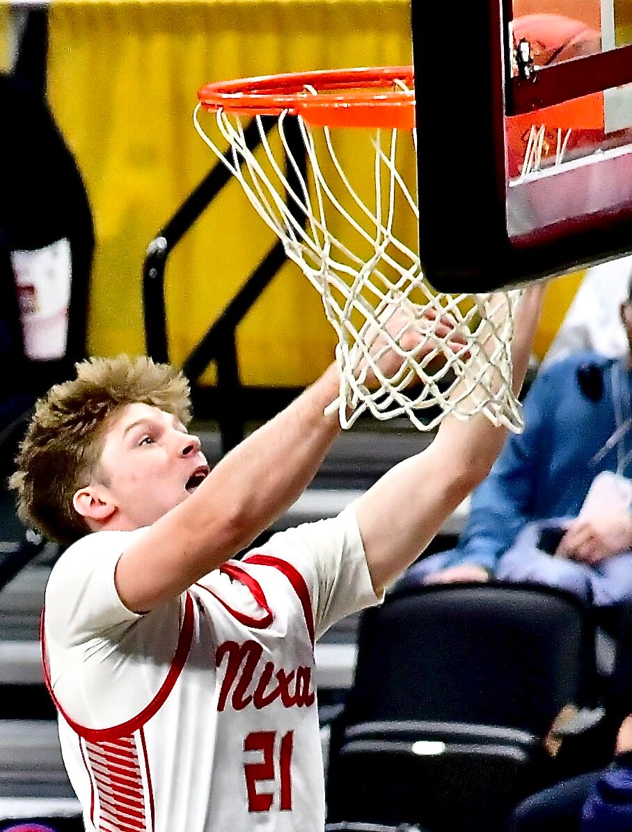 NIXA'S ADAM MCKNIGHT banks in a layup.