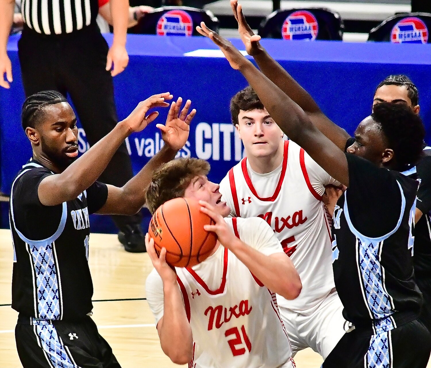 NIXA'S ADAM MCKNIGHT works in the paint.