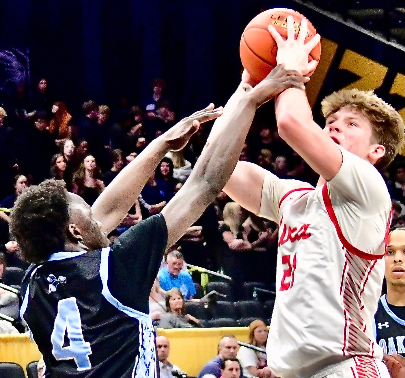 NIXA'S ADAM MCKNIGHT draws an Oak Park foul.