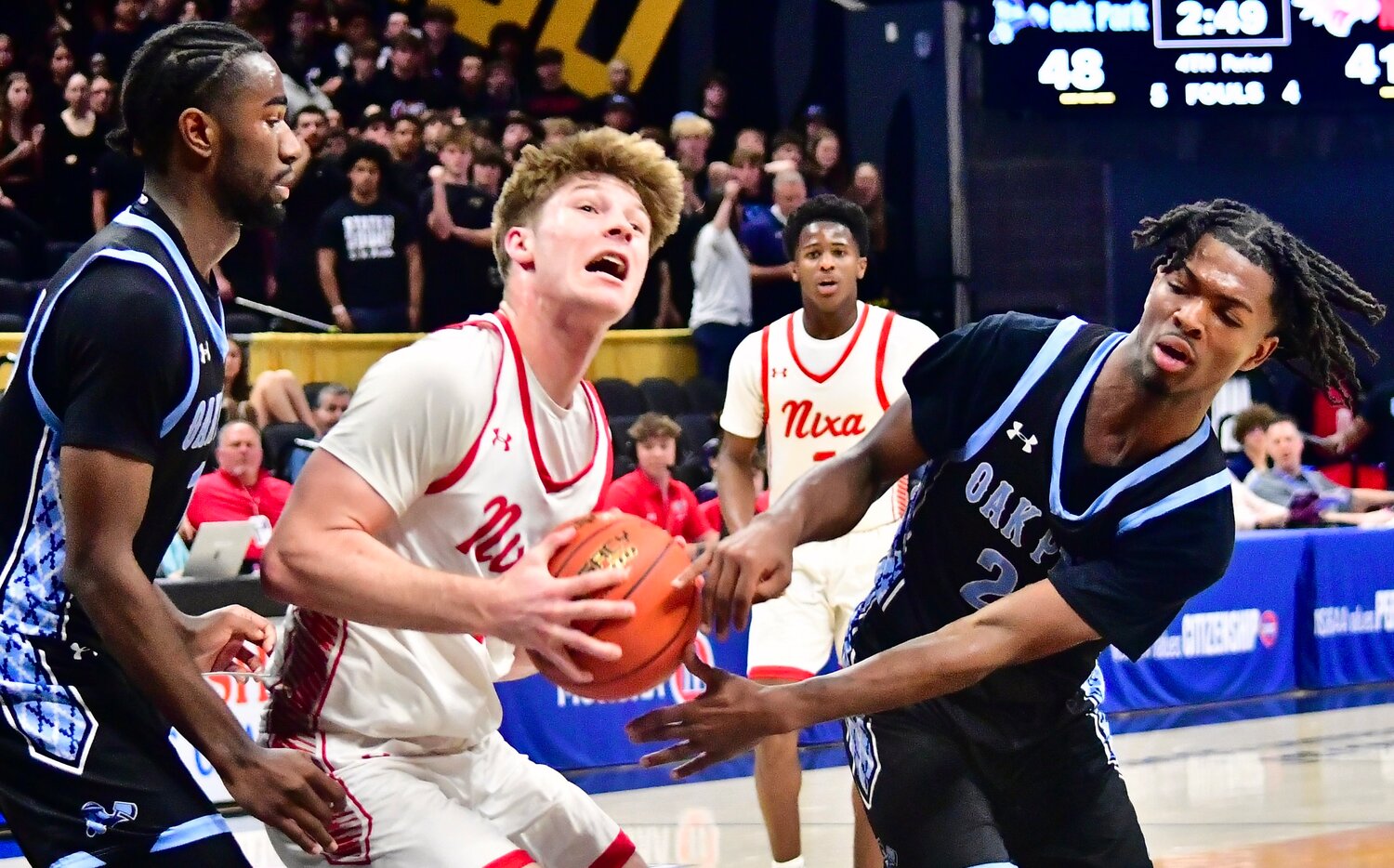 NIXA'S ADAM MCKNIGHT protects the ball.