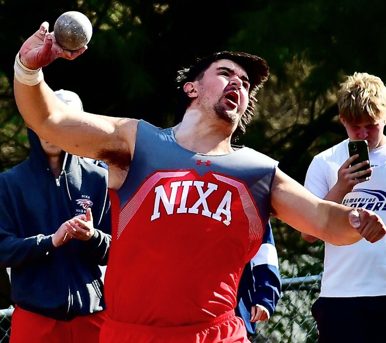 NIXA'S JACKSON CANTWELL heaves the shot put at the Jim Vaughan Invitational in Springfield.