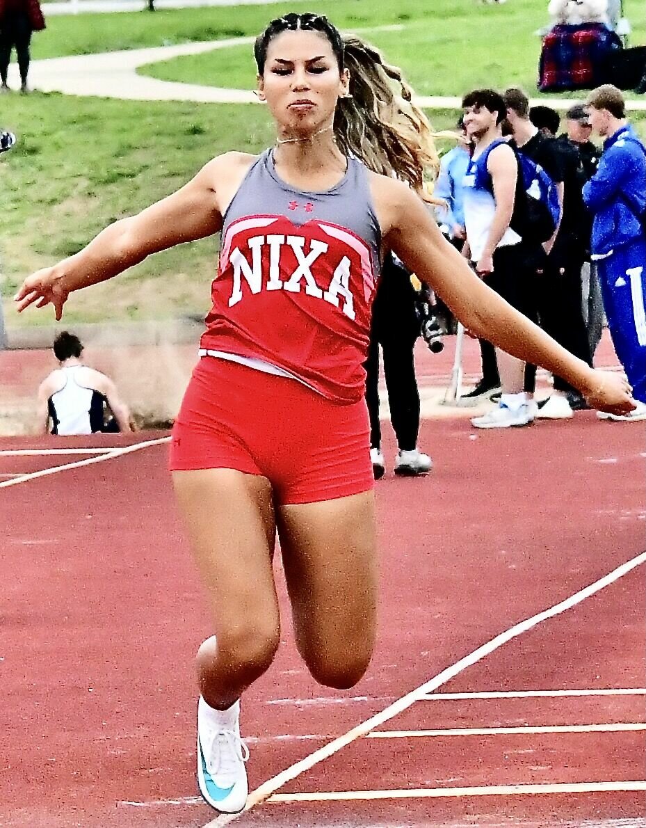 NIXA'S RYLEE ENG displays her winning form in the triple jump.