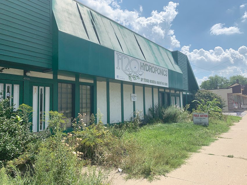 (Above) County officials anticipate the former CC Greenery building in Okemos — one of only a few commercial properties at auction — to sell for upwards of $300,000 this week, although the reserve price is only set at about $39,000.