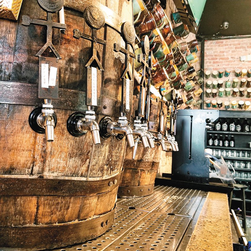 Barrel taps at Mason’s BAD Brewing. Mug Club members’ drinking vessels adorn the walls of the brewery.