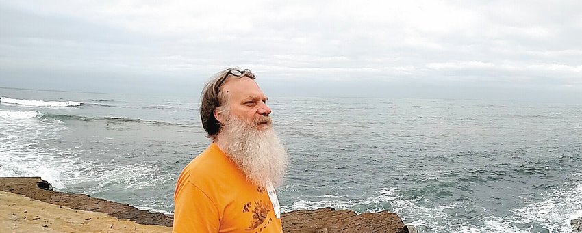Rick Preuss surveys the Pacific Ocean during a break at a convention in San Diego.